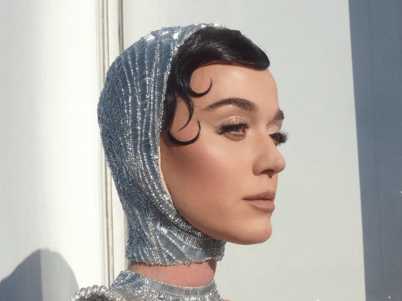 Katy Perry wearing a silver scarf