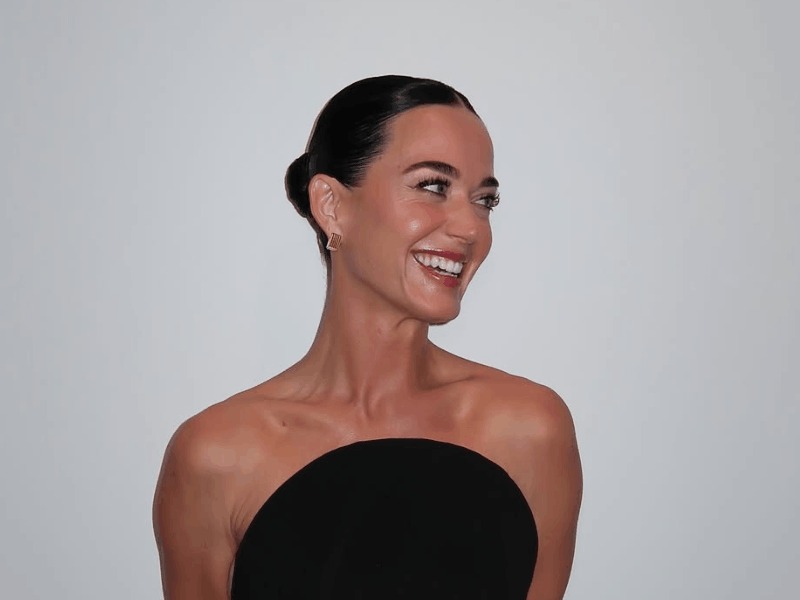 Katy Perry wearing a strapless black dress