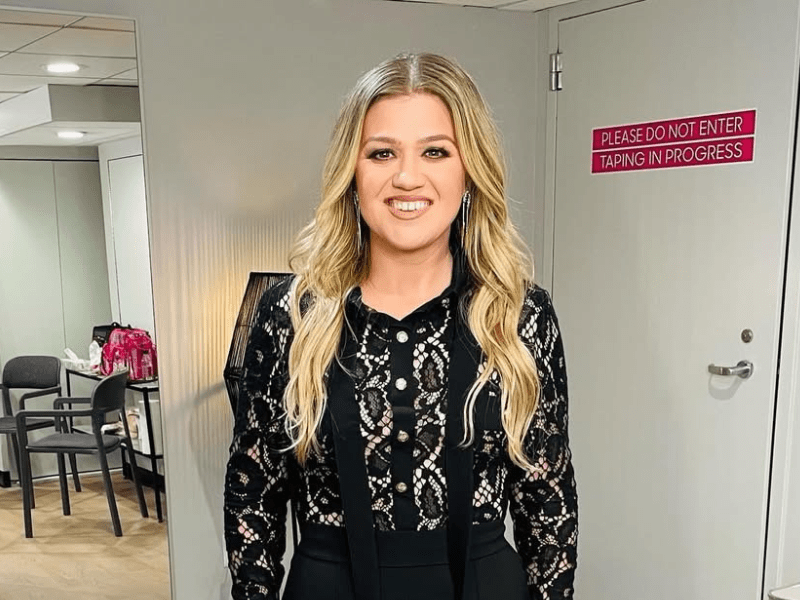 Kelly Clarkson wearing a long sleeved lace top
