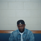 Kendrick Lamar wearing a denim blue jacket