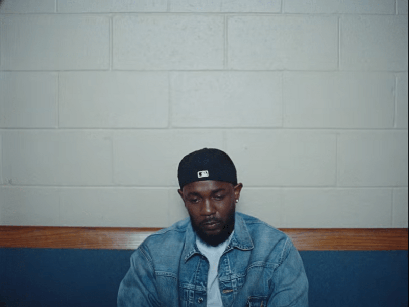 Kendrick Lamar wearing a denim blue jacket