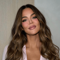 Khloe Kardashian wears her blonde hair is soft curls