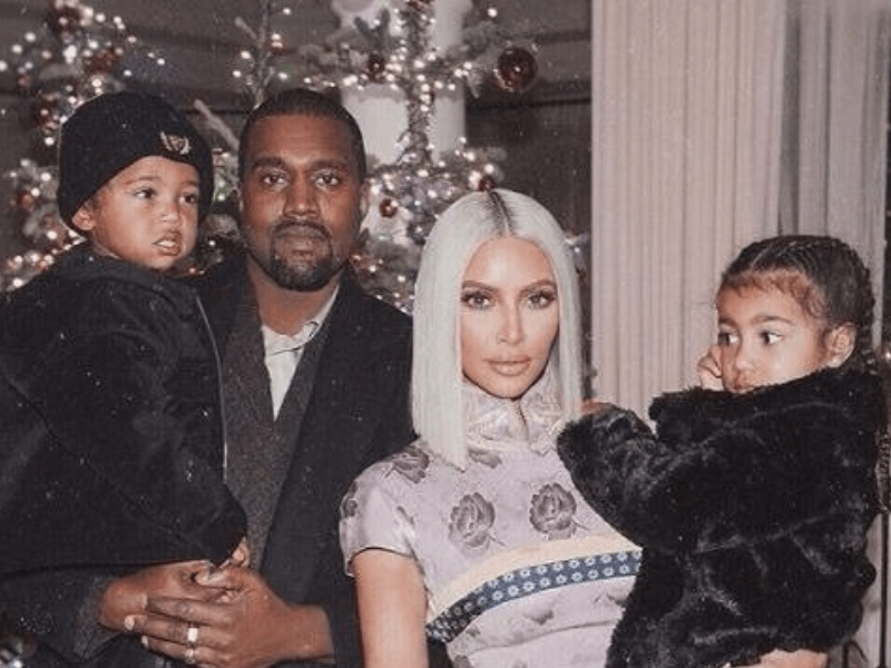 Kim Kardashian and Kanye West with their children