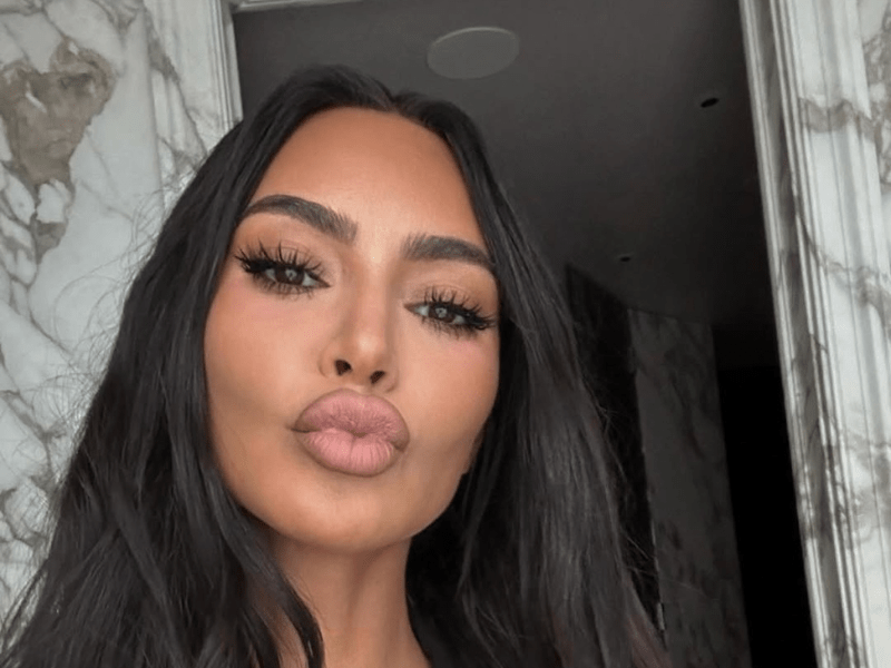 Kim Kardashian pouts her lips while taking a selfie