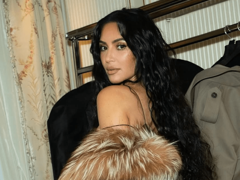 Kim Kardashian glances over shoulder