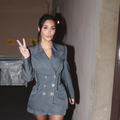 Kim Kardashian wearing a grey blazer