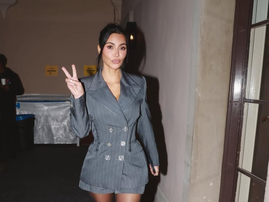 Kim Kardashian wearing a grey blazer