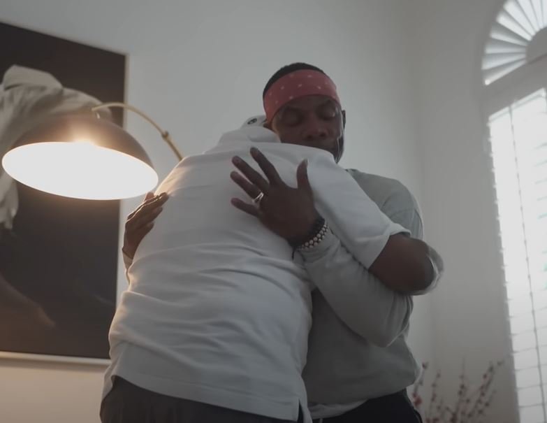 Kirk Franklin hugging his father