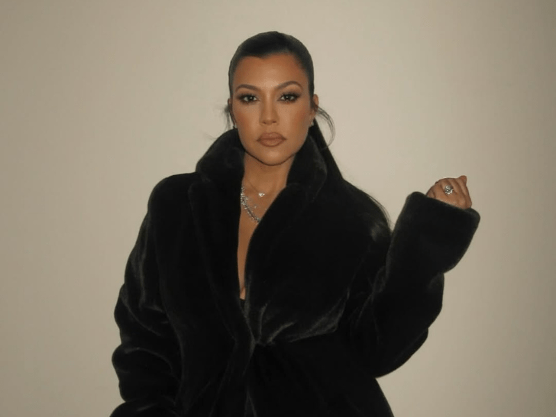 Kourtney Kardashian wearing a fur coat
