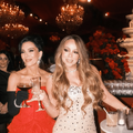 Kris Jenner and Mariah Carey pose with champagne glasses
