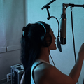 Kylie Jenner singing in a recording booth