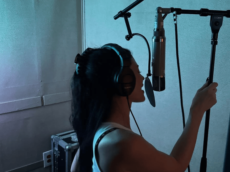 Kylie Jenner singing in a recording booth