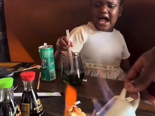 LITTLE GILR REACTING TO FLAMING FOOD