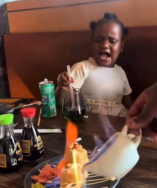 LITTLE GILR REACTING TO FLAMING FOOD