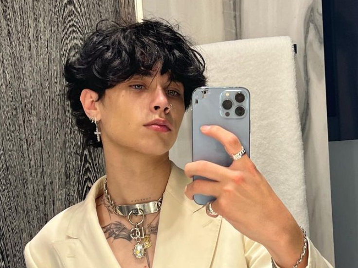 Landon Barker holding phone