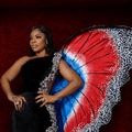 Laura Ikeji wearing a butterfly dress