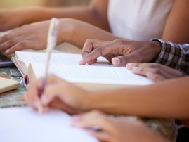 Learners reading in a group