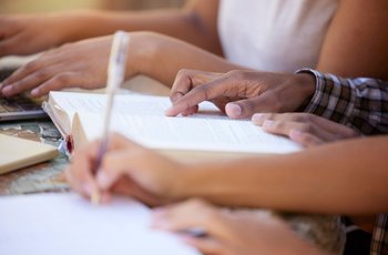 Learners reading in a group