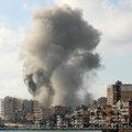 Smoke rises from the site of an Israeli airstrike that targeted a neighborhood in the southern Lebanese