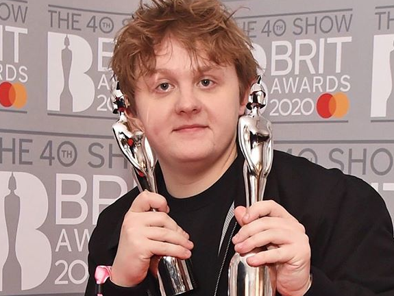 Lewis Capaldi holding awards