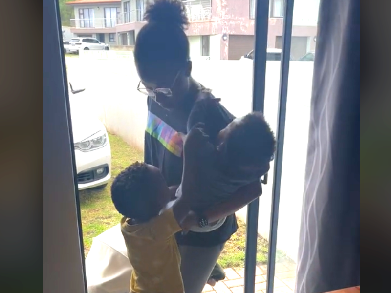 Little boy grabs his baby brother away from mother