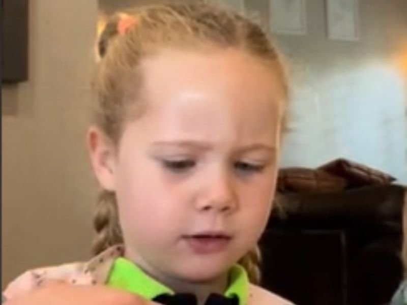 Screenshot of a video showing a little girl trying shop-bought Magwinyas