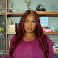 Lizzo wearing a red wig