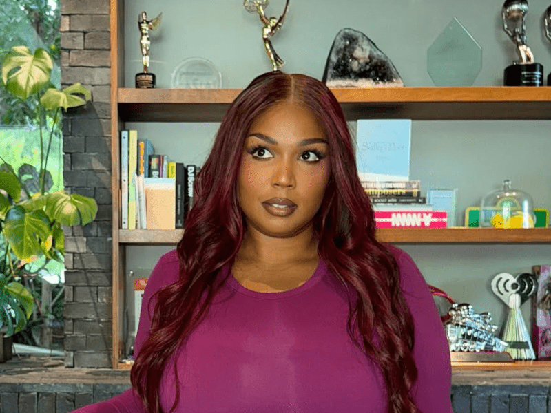 Lizzo wearing a red wig