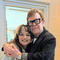 Lola Young and Elton John hugging
