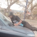 MAN HANGING ON CARS BONNET MBOMBELA