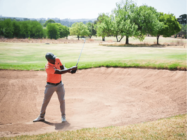 MAN PLAYING GOLF JACARANDA FM GOLF DAY