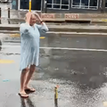MELVILLE WOMAN TAKING SHOWER IN STREET