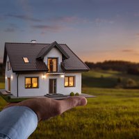 Male hand showing offering a new dream house