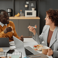 Man and woman having lunch together at work