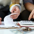 Man and woman looking at accounts and finances