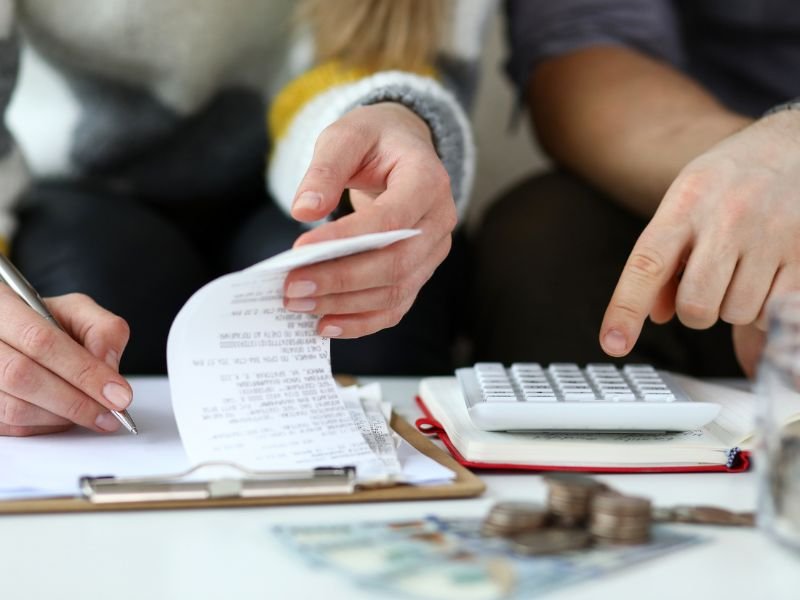 Man and woman looking at accounts and finances