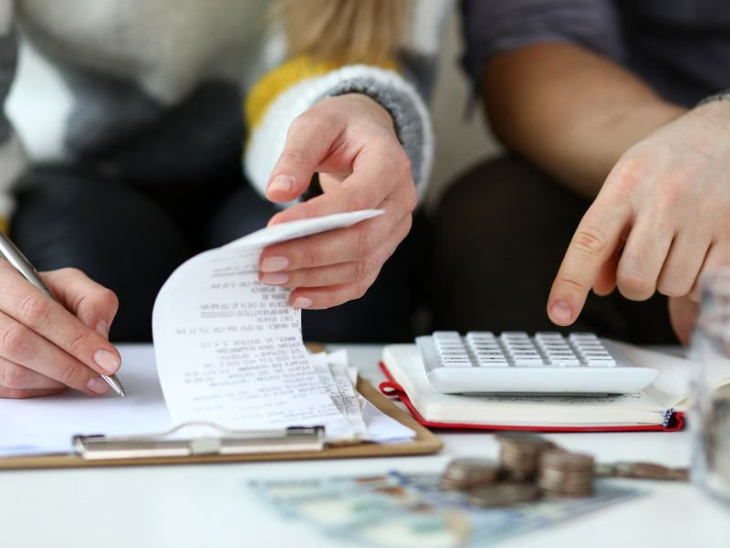 Man and woman looking at accounts and finances