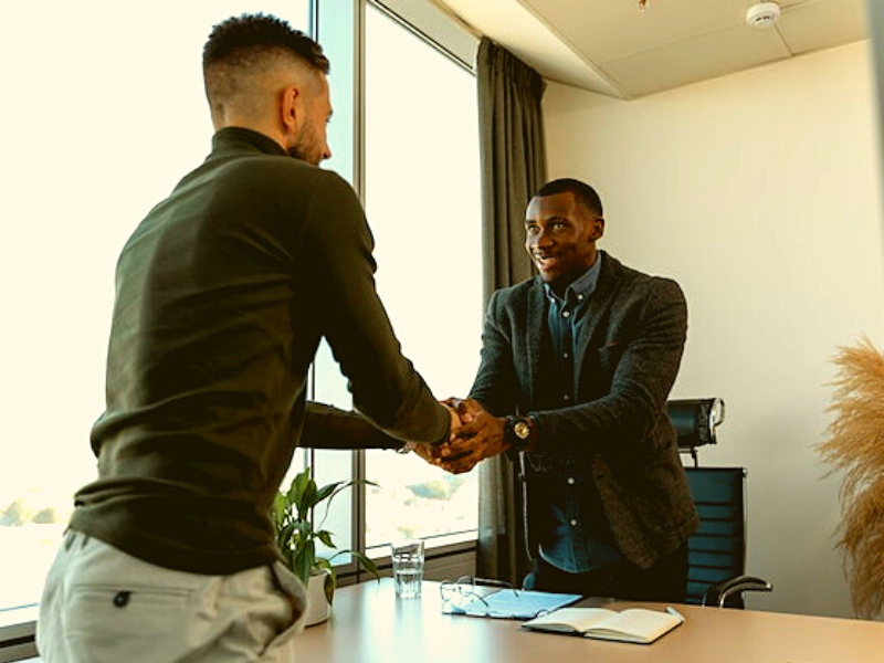 Man gets the job and shakes interviewer's hand
