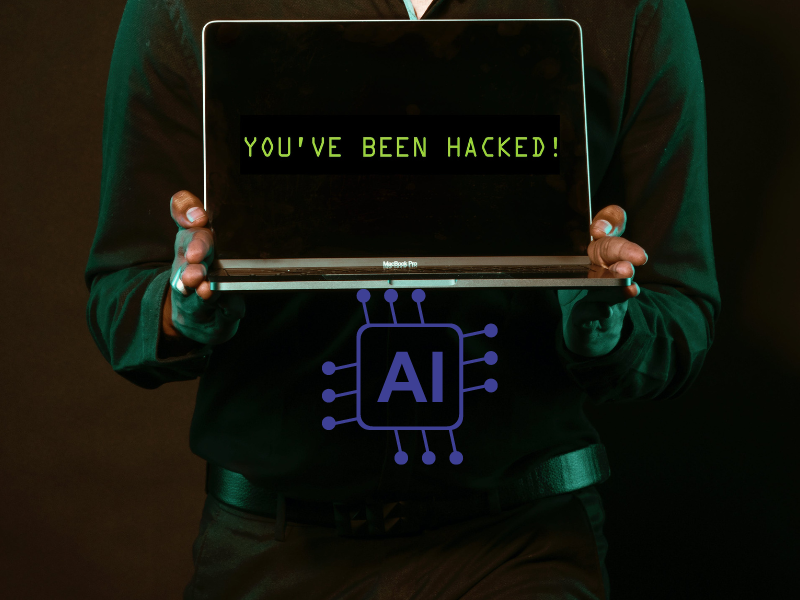 Man holding laptop with both hands and it reads you have been hacked