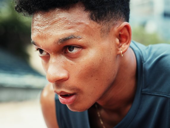 Man looking exhausted from running and exercising