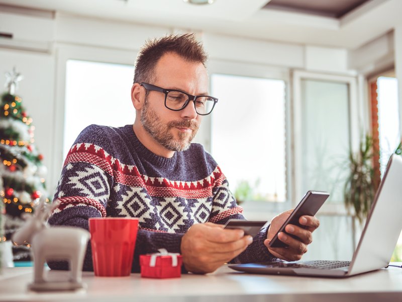 Man spending money on Christmas