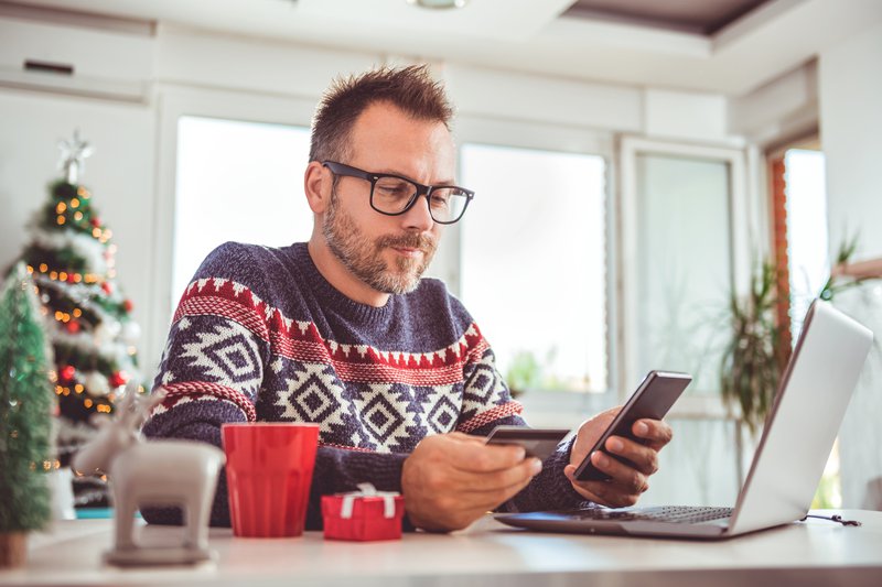 Man spending money on Christmas