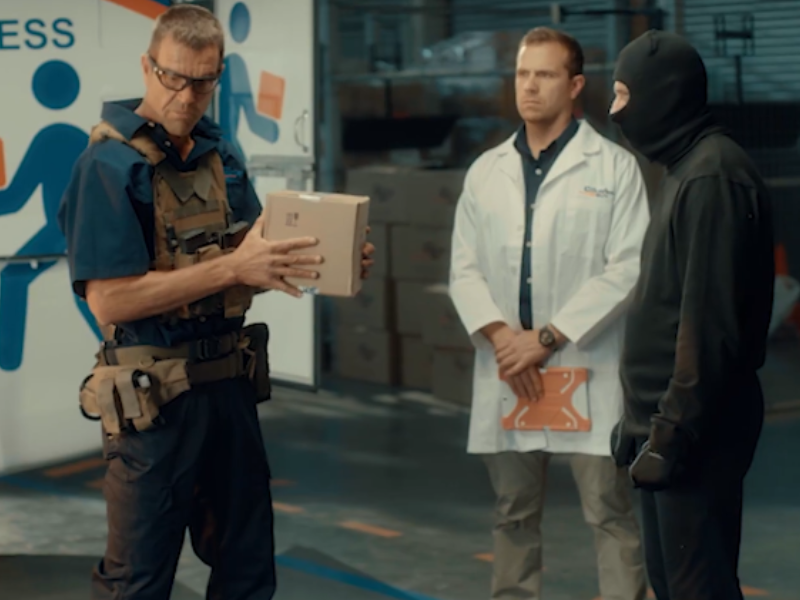 Man teaching defense class to group of people