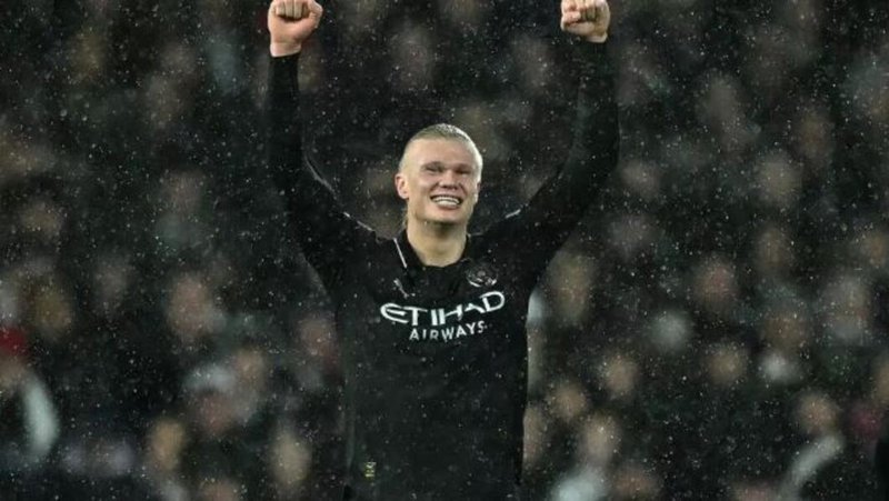 Manchester City striker Erling Haaland celebrates scoring against Fulham