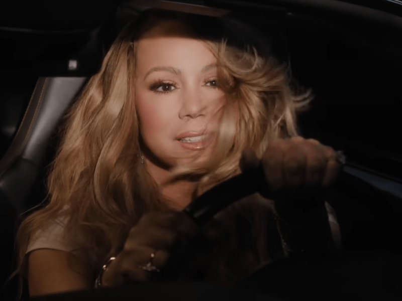 Mariah Carey behind the wheel of a car