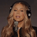Mariah Carey wearing black headphones