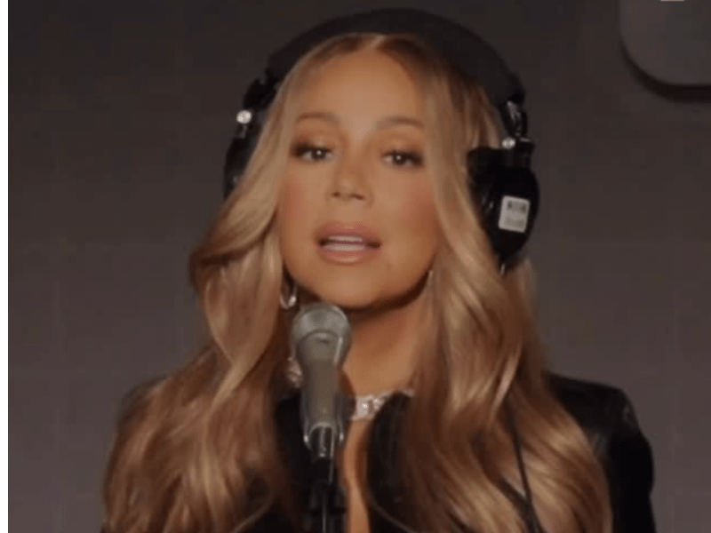 Mariah Carey wearing black headphones