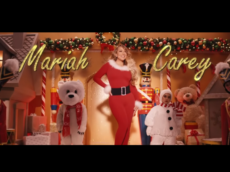 Mariah Carey in a red Christmas themed jumpsuit
