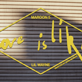 Sectional garage door with Maroon 5 Love Is Like text in yellow