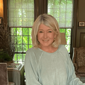 Martha Stewart poses in a room with vintage style decor